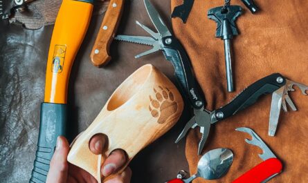 axe knife and swiss knives lying on floor