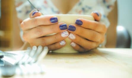 person holding white ceramic bowl