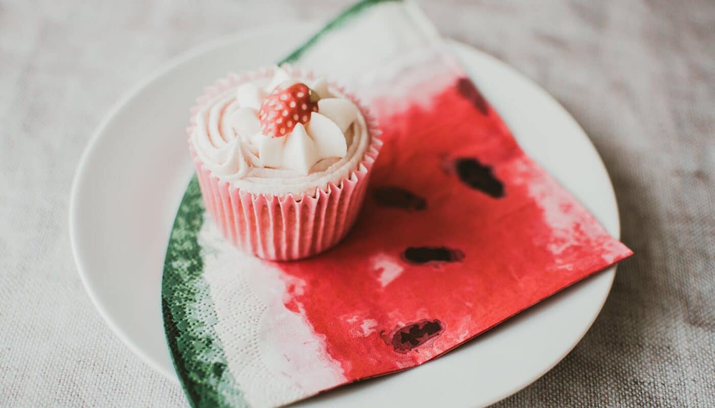 flat lay photography of cupcake on plate