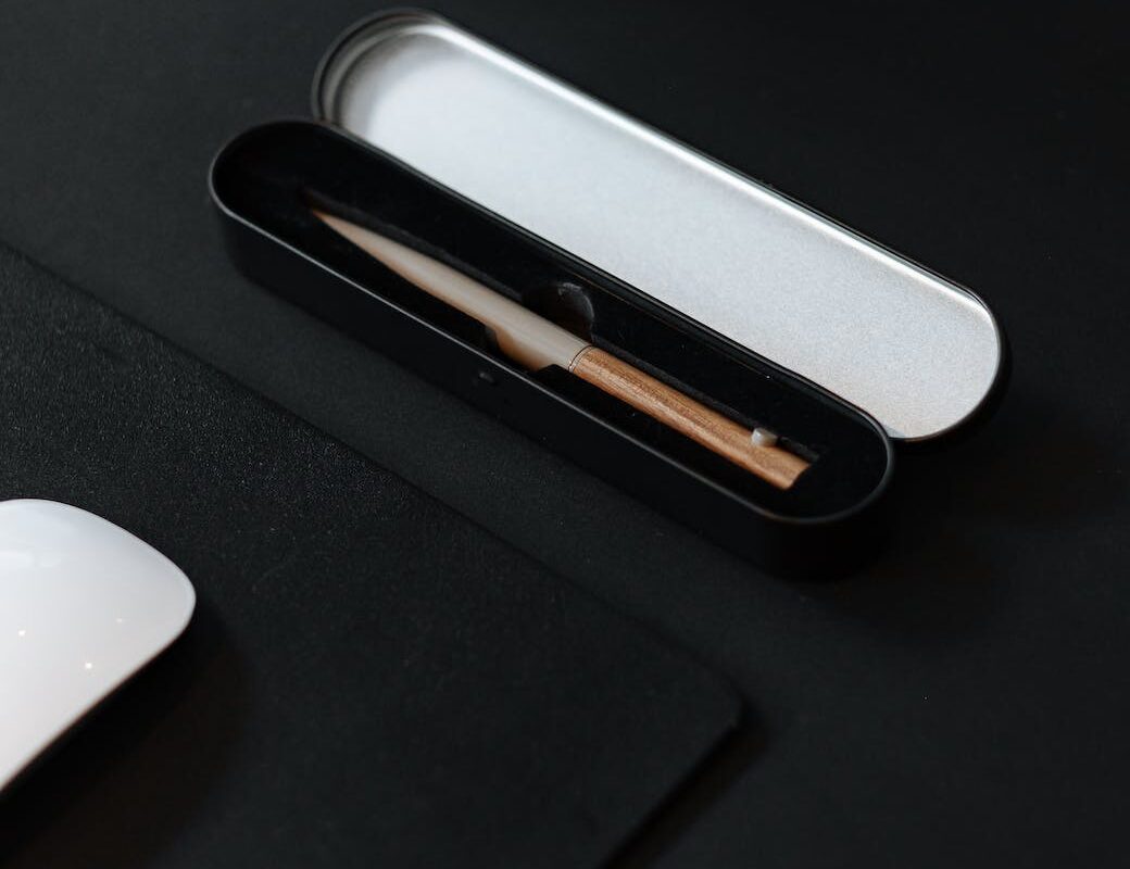 small black case for pencil on black surface