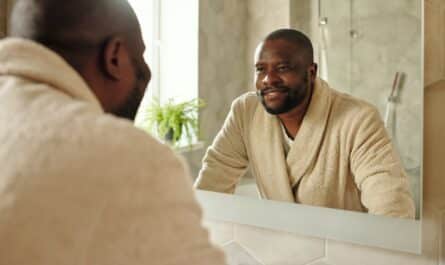 a man looking at a mirror