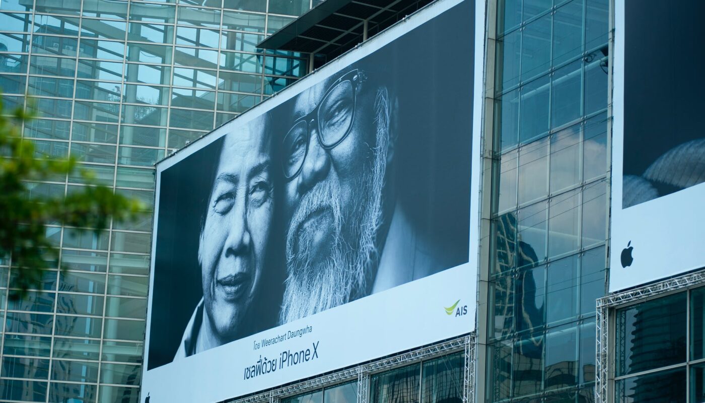 man beside woman billboard