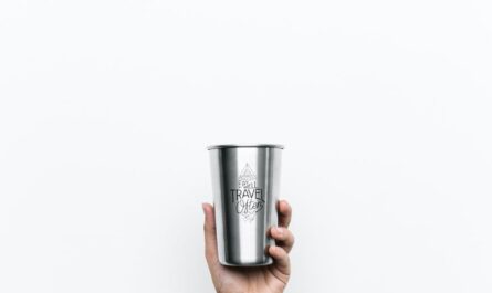 person holding gray cup