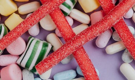 multicolored candies on lilac surface