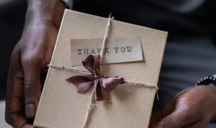 crop black man with gift box