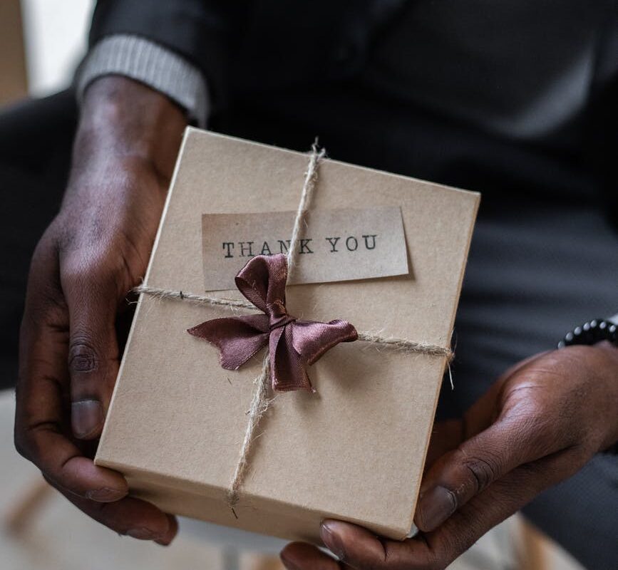 crop black man with gift box