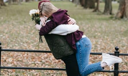 happy couple embracing in park