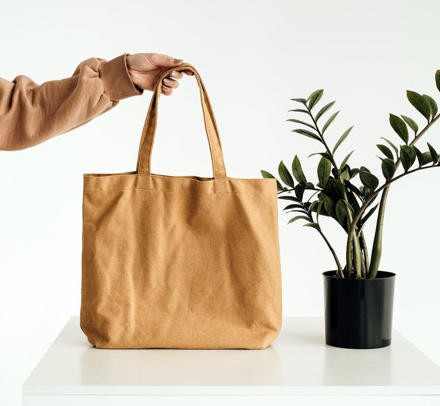 brown tote bag on white table