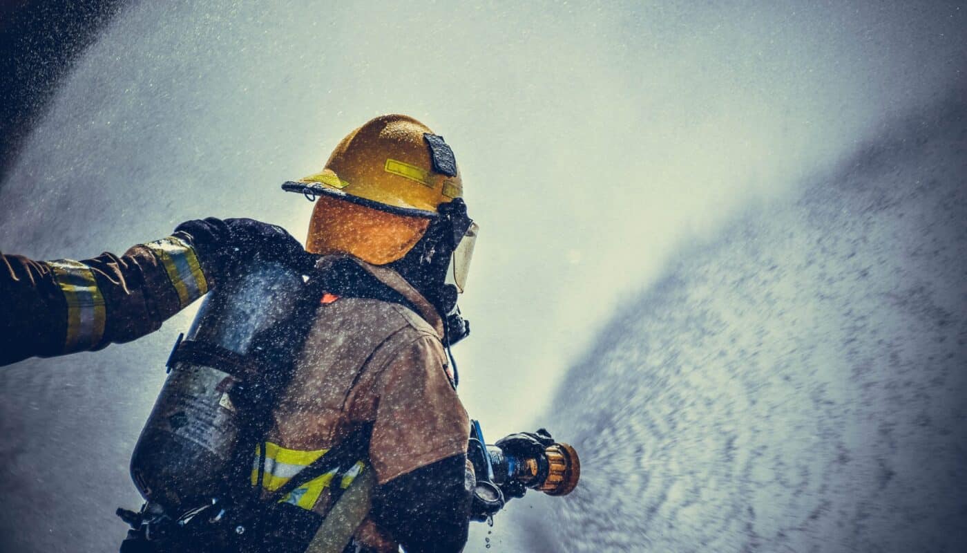 fireman holding fire hose