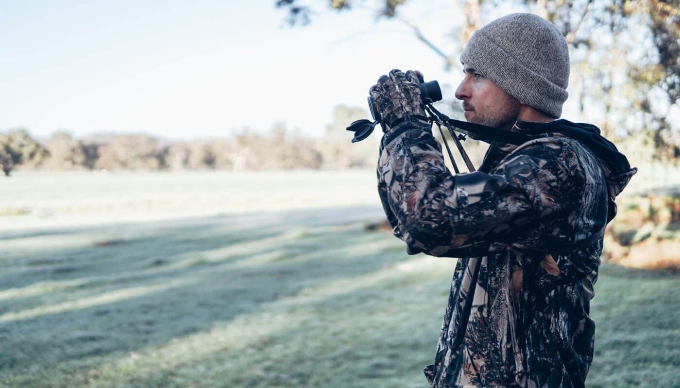 man holding binoculars