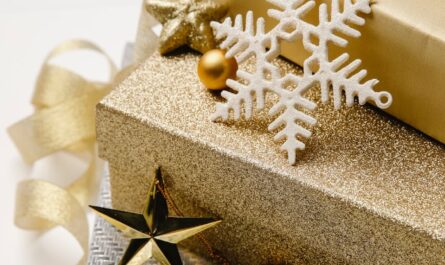 boxes with christmas presents and swirling ribbon