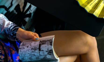 woman sitting and reading comic book