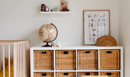 interior of children bedroom with wooden furniture and toys and globe placed on shelves in room