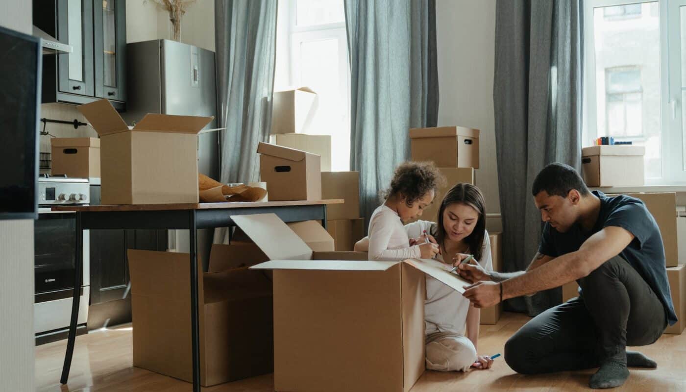 family unpacking after moving