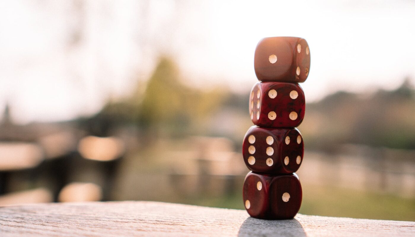 red dice stacked on table on terrace