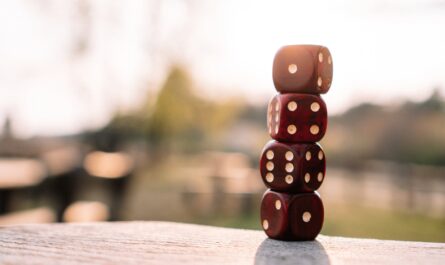 red dice stacked on table on terrace