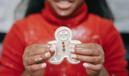 cute black girl showing homemade gingerbread man