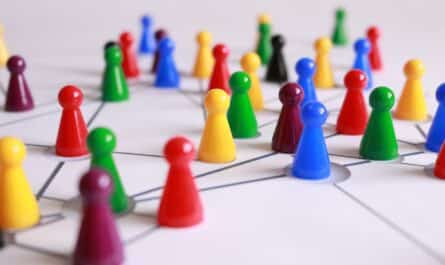 close up photography of yellow green red and brown plastic cones on white lined surface